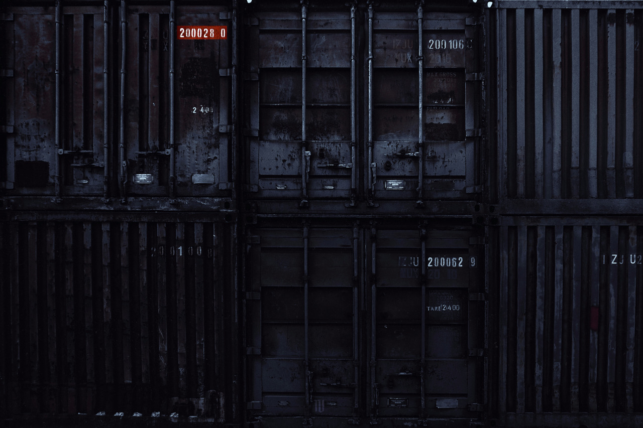 The meme is an image of a dark, abandoned warehouse with rows of old shipping containers stacked on top of each other. The text "I'm not arguing, I'm just explaining why I'm right" appears in the corner of the image, implying that the speaker is trying to justify their position in a heated conversation. The image's dark and industrial setting adds to the sense of tension and conflict.